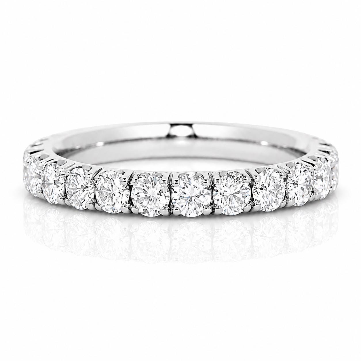 A diamond band with a row of round diamonds set in a silver band.