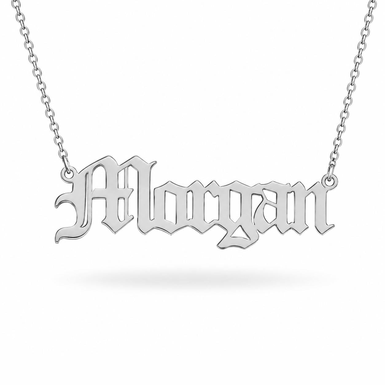 A silver necklace with the name "Morgan" engraved on it.