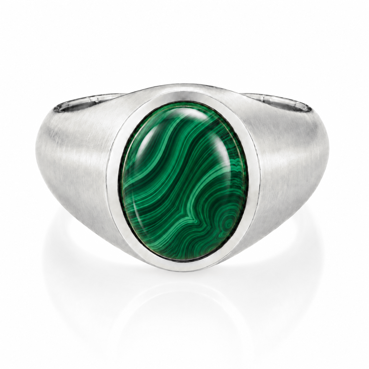 A silver ring with a large oval-shaped green gemstone in the center.