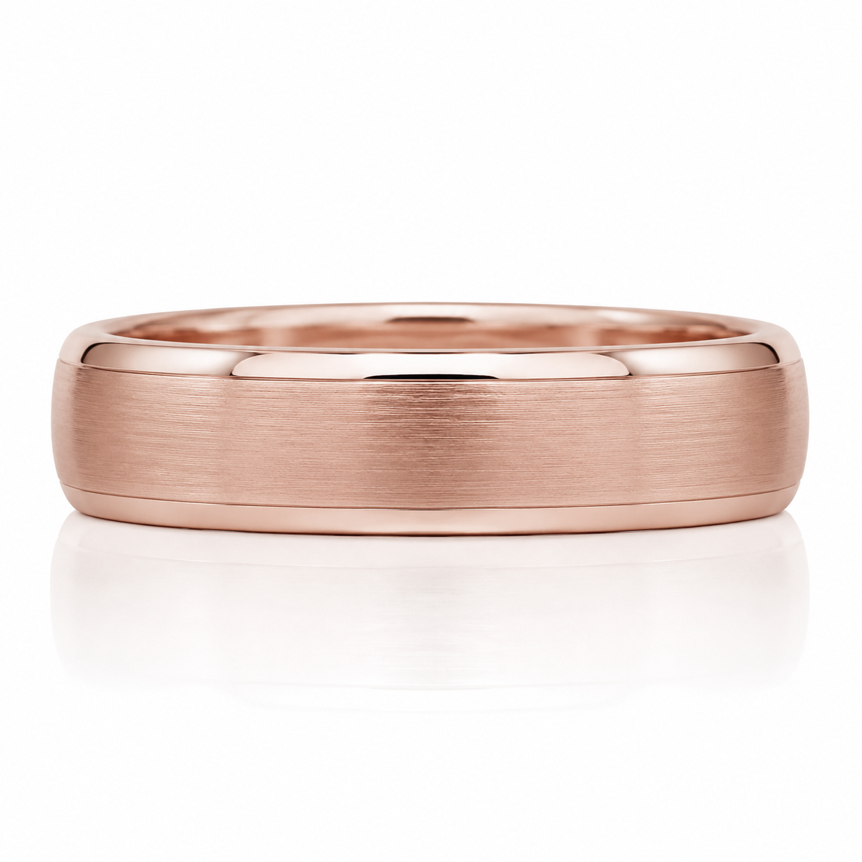 A rose gold ring with a textured surface and a smooth band, set against a white background.