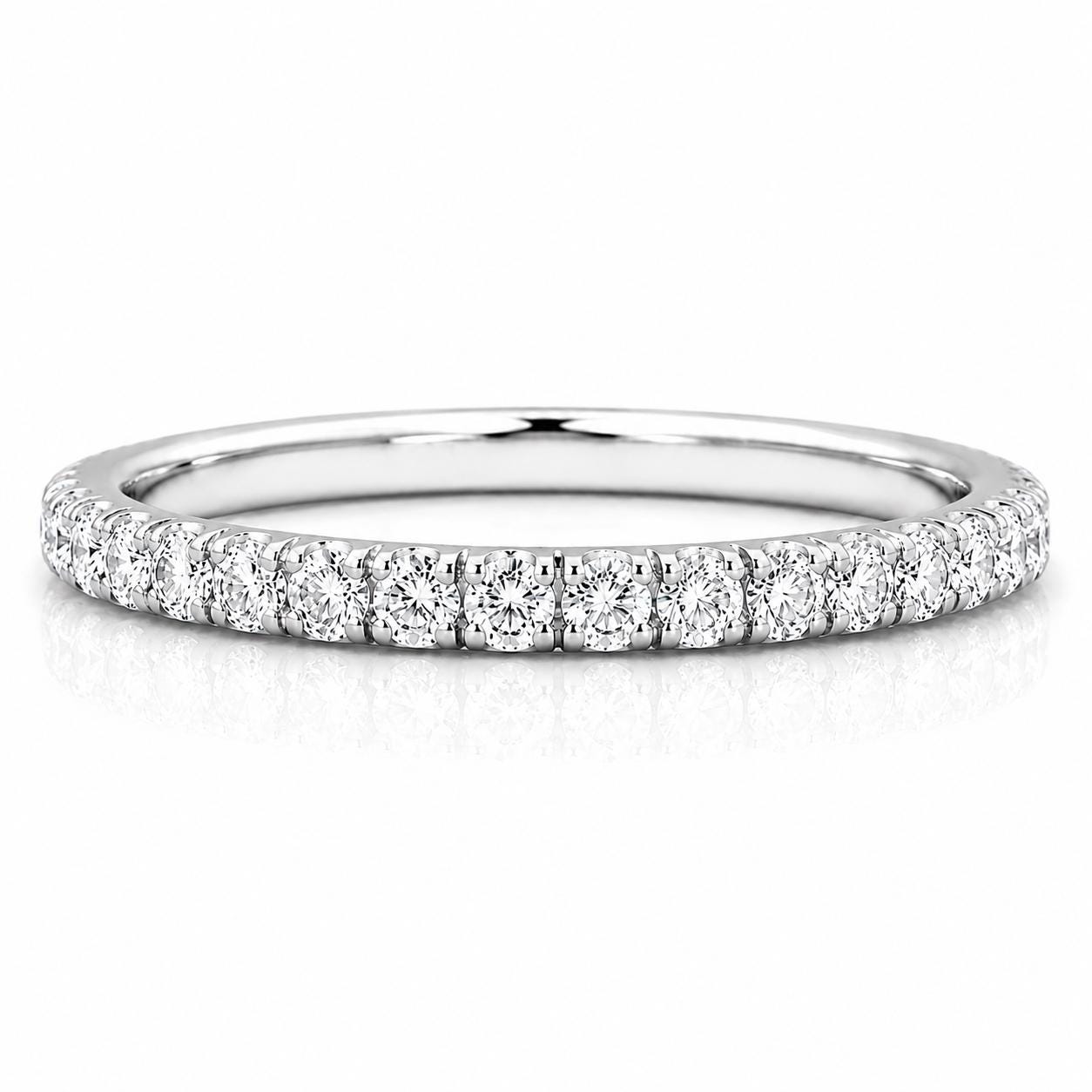 A silver band ring with a row of small diamonds set in it.