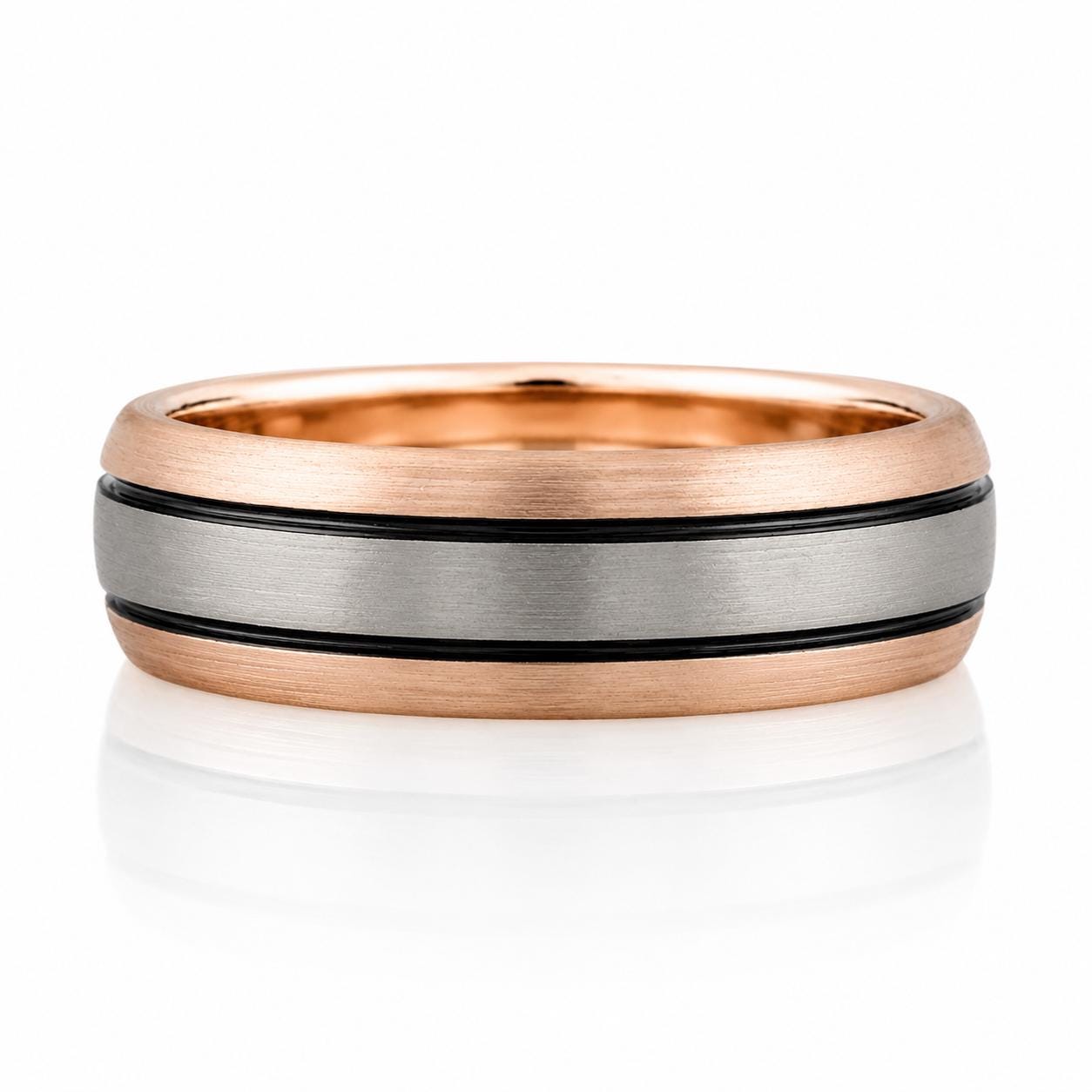 A gold and silver ring with a metallic band featuring a striped pattern.