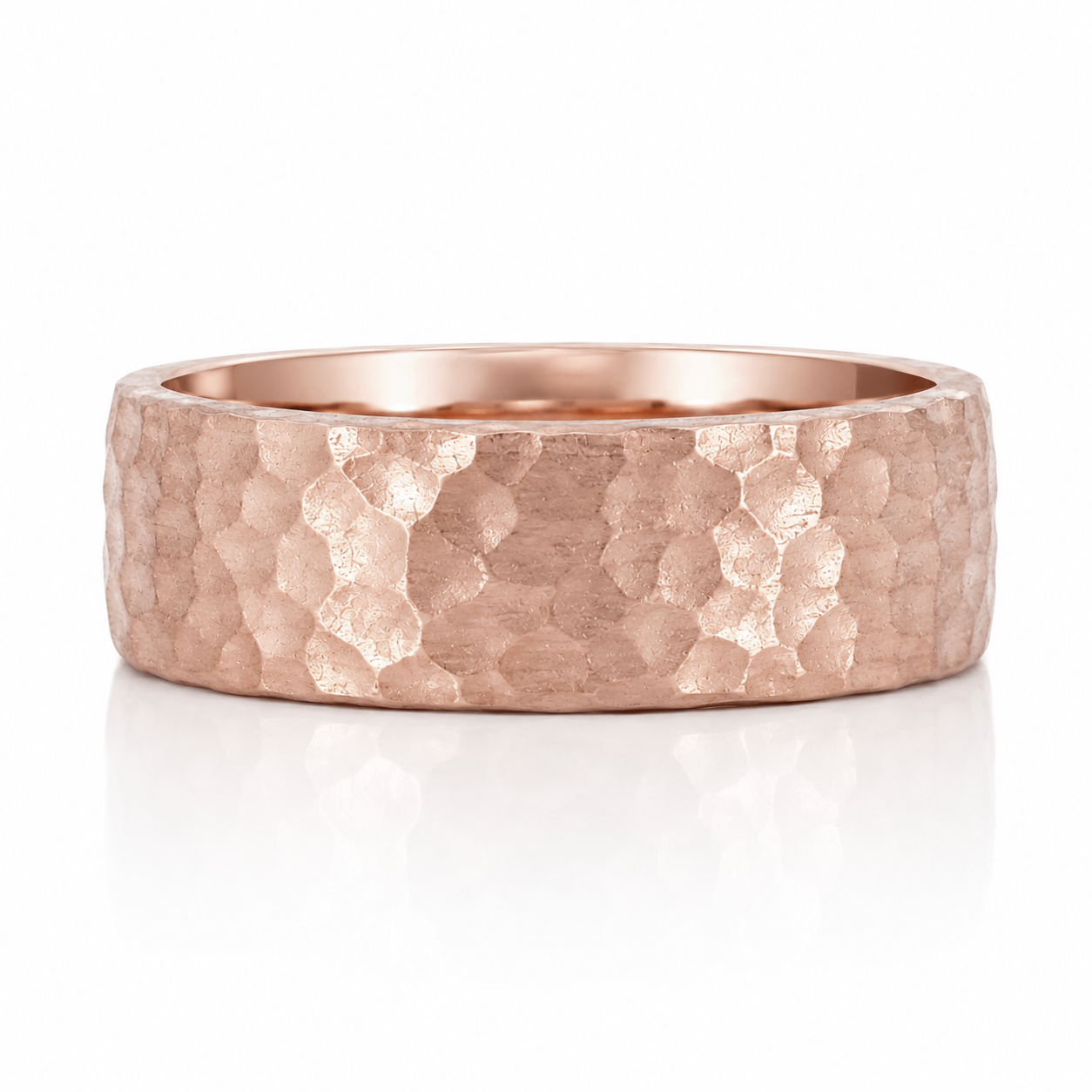 A close-up image of a copper-colored ring with a textured, embossed surface.