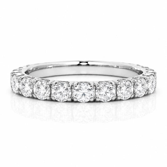 A diamond ring with a row of round diamonds set in a silver band.