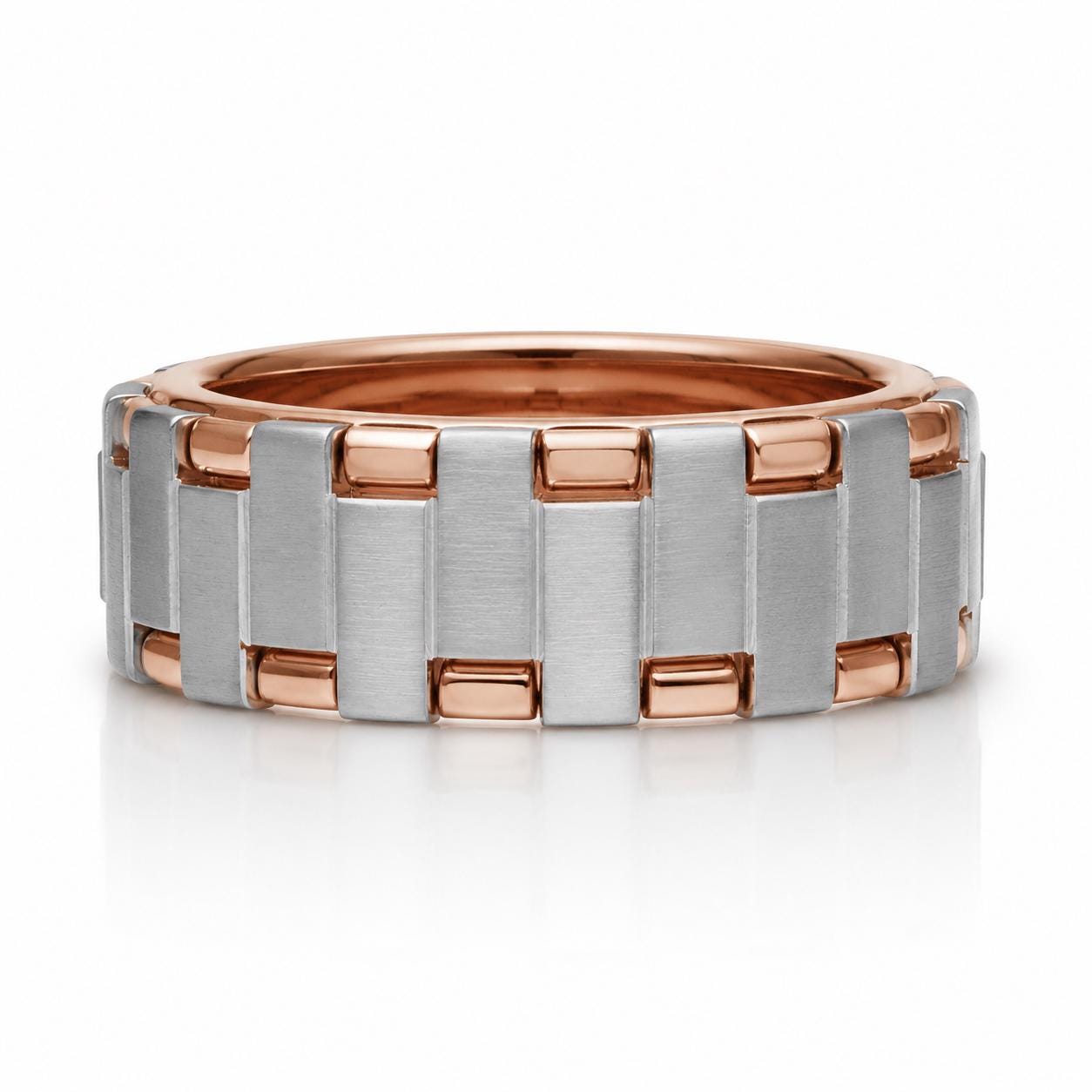 A silver and copper ring with a repeating pattern of interlocking silver and copper bands.
