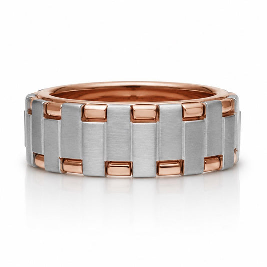 A silver and copper ring with a repeating pattern of interlocking silver and copper bands.