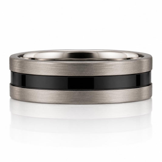 A silver ring with a black band in the center, set against a white background.