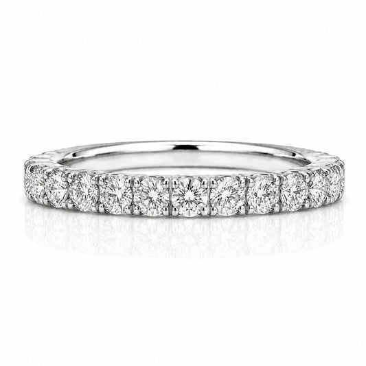 A diamond-encrusted ring with a row of round diamonds set in a silver band.