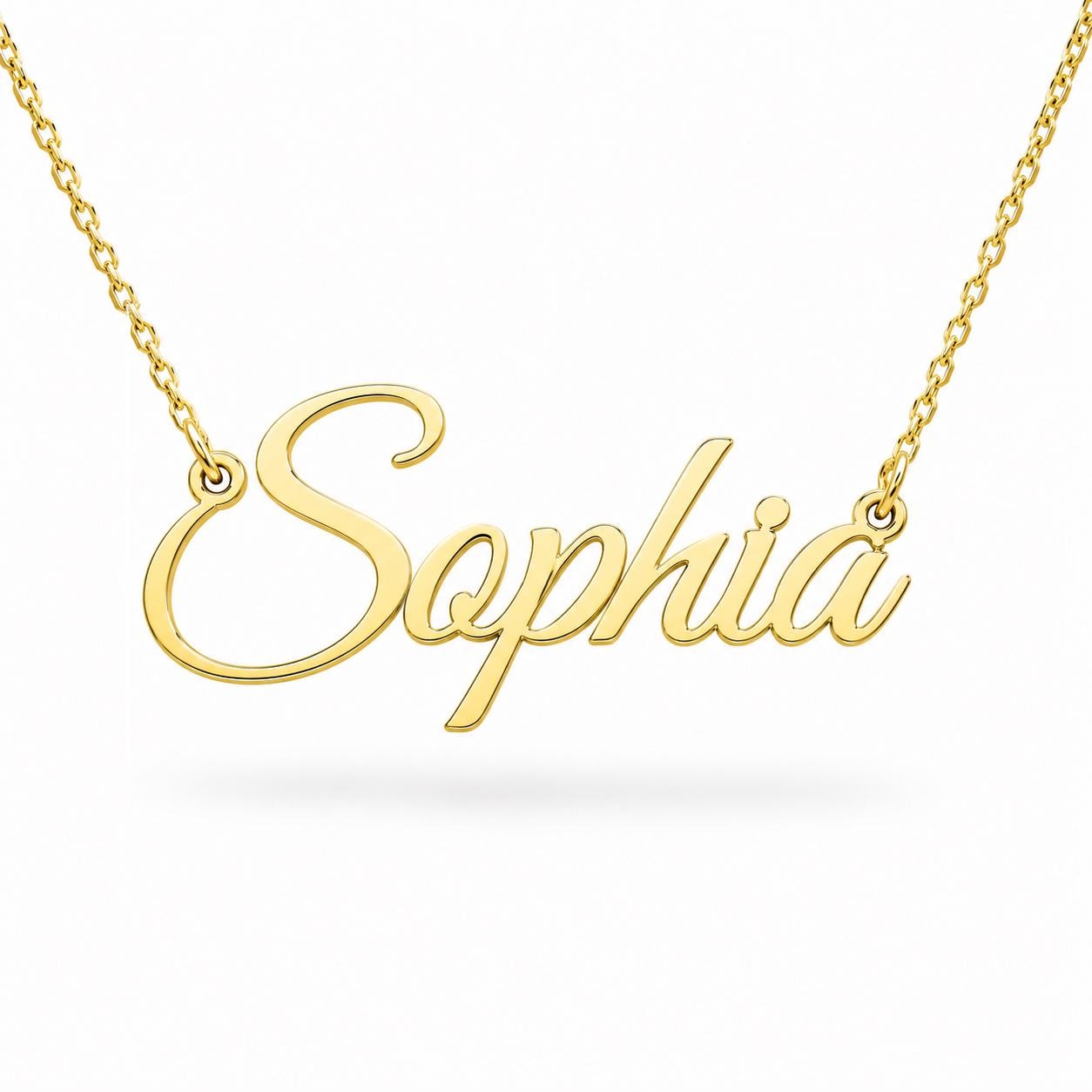 A gold-colored necklace with the word "Sophia" engraved on it.