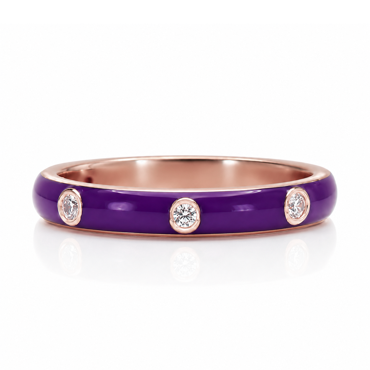 A ring with a purple band and three small diamonds set in it.