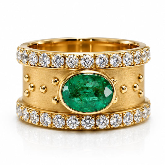 A gold ring with a large oval-shaped gemstone in the center, surrounded by smaller diamonds.
