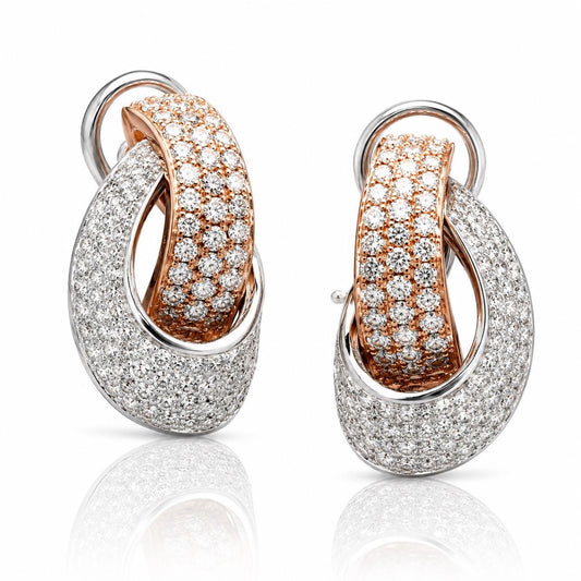 A pair of elegant earrings with a combination of gold and white diamonds set in a circular pattern.
