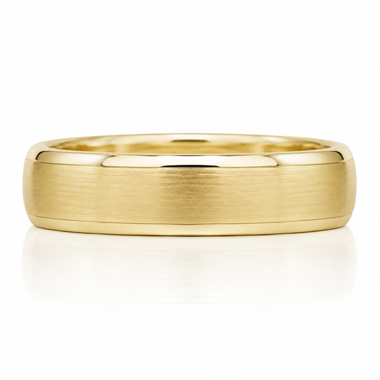 A gold ring with a smooth, polished surface and a slight curve at the top.