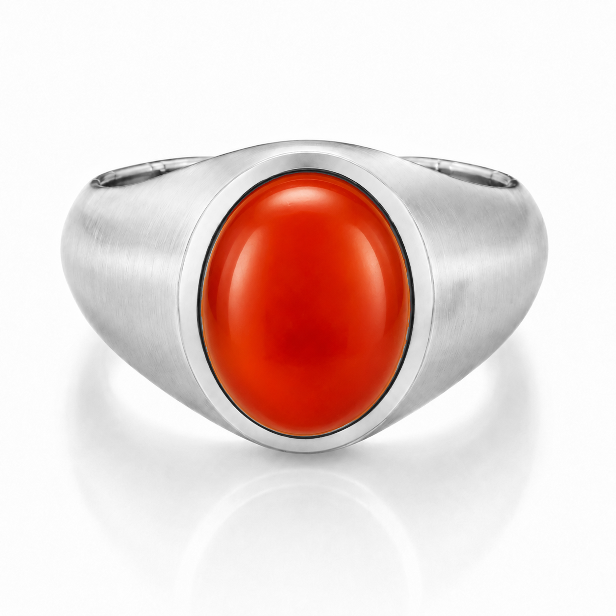 A silver ring with a large, bright red gemstone in the center.