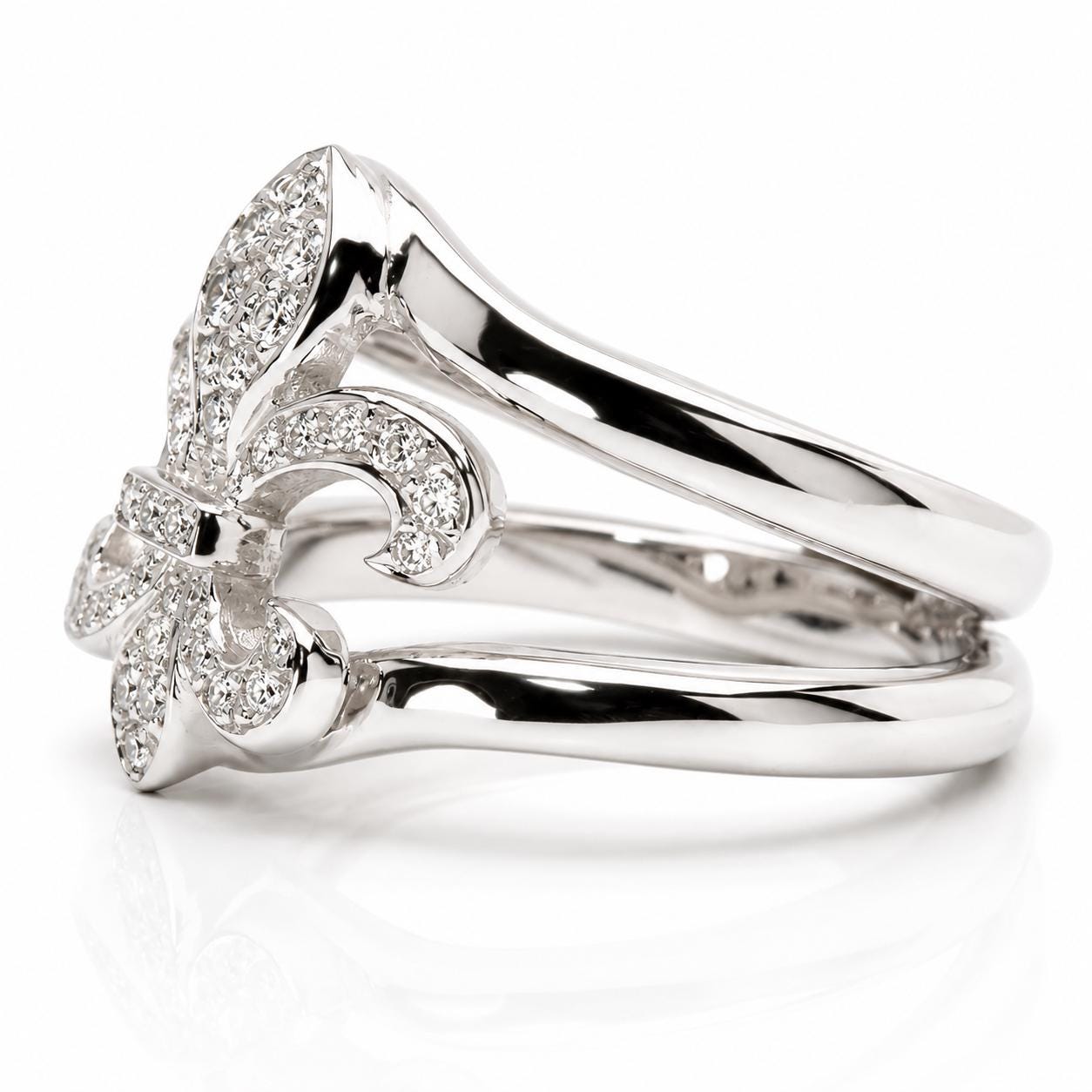 A silver ring with a large central flower-shaped gemstone surrounded by smaller gemstones.