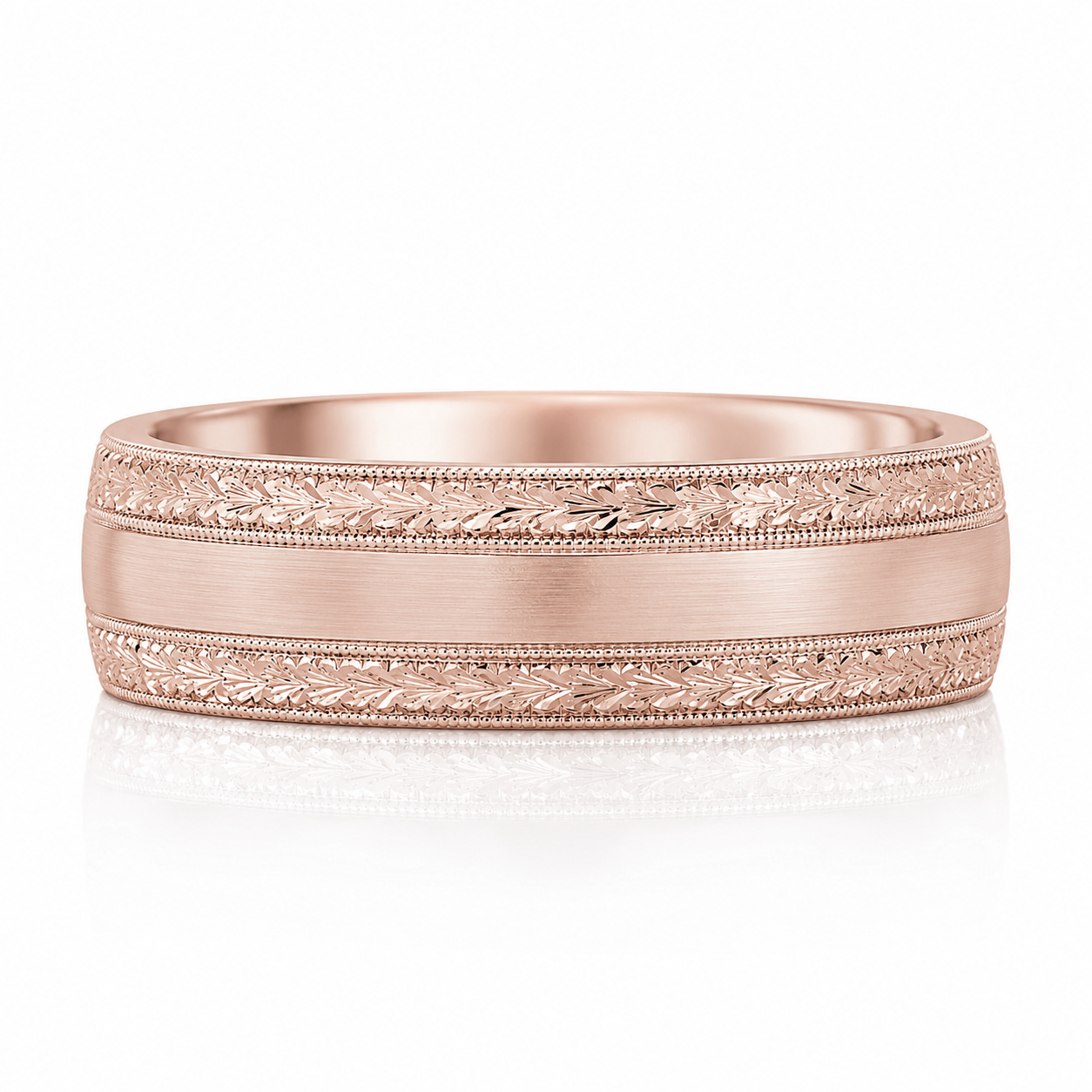 A rose gold wedding band with a decorative band design featuring leaf patterns.